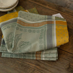 Stack of patterned napkins on a wooden surface