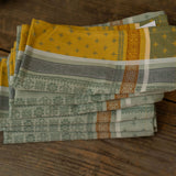 Stack of patterned napkins on a wooden surface