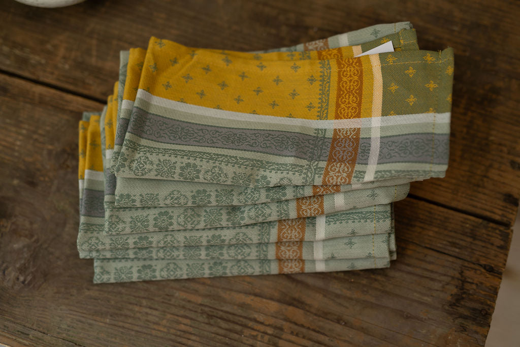 Stack of patterned napkins on a wooden surface