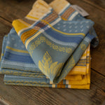 Stack of patterned napkins on a wooden surface