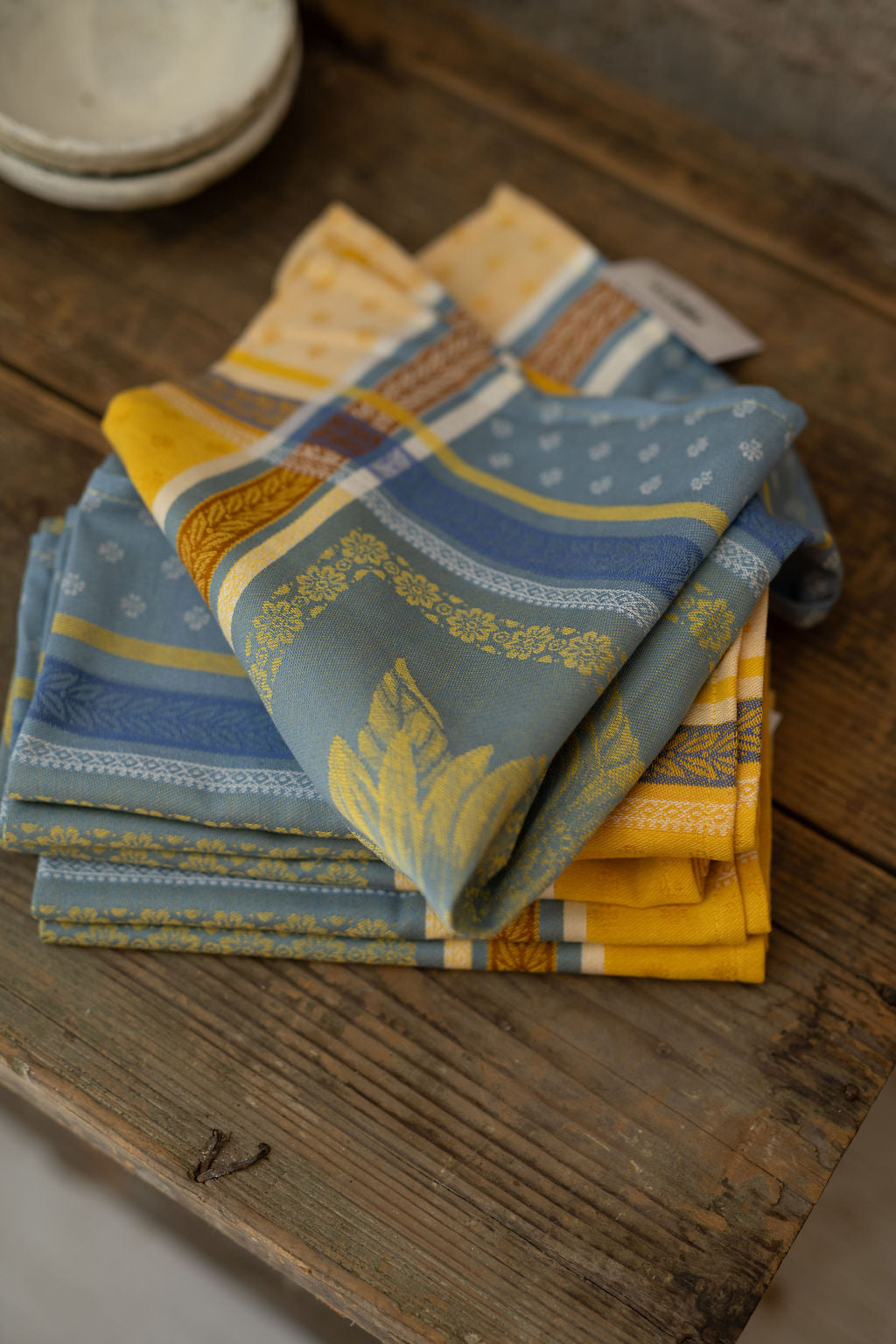 Stack of patterned napkins on a wooden surface