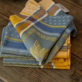 Stack of patterned napkins on a wooden surface