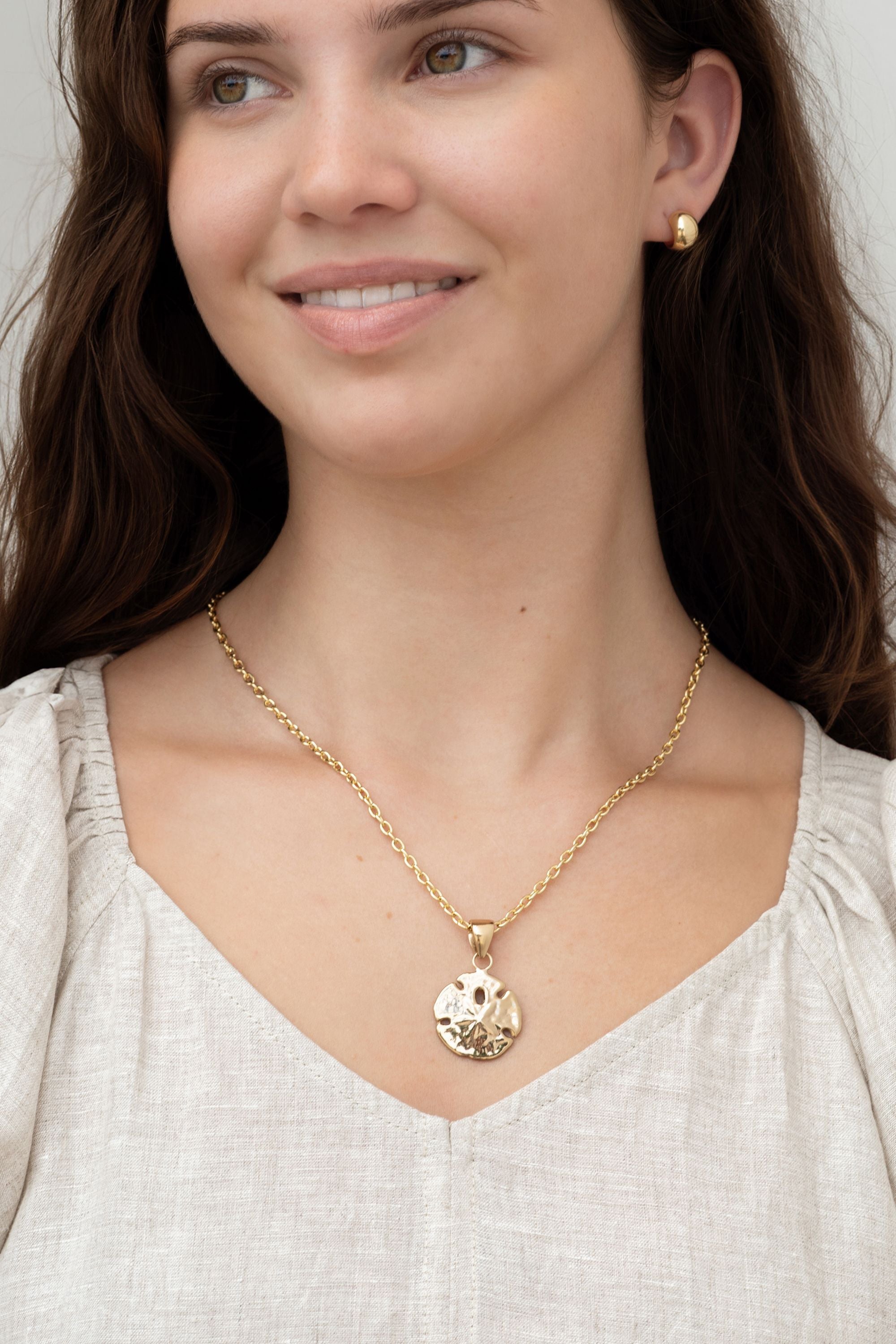 gold sand dollar charm